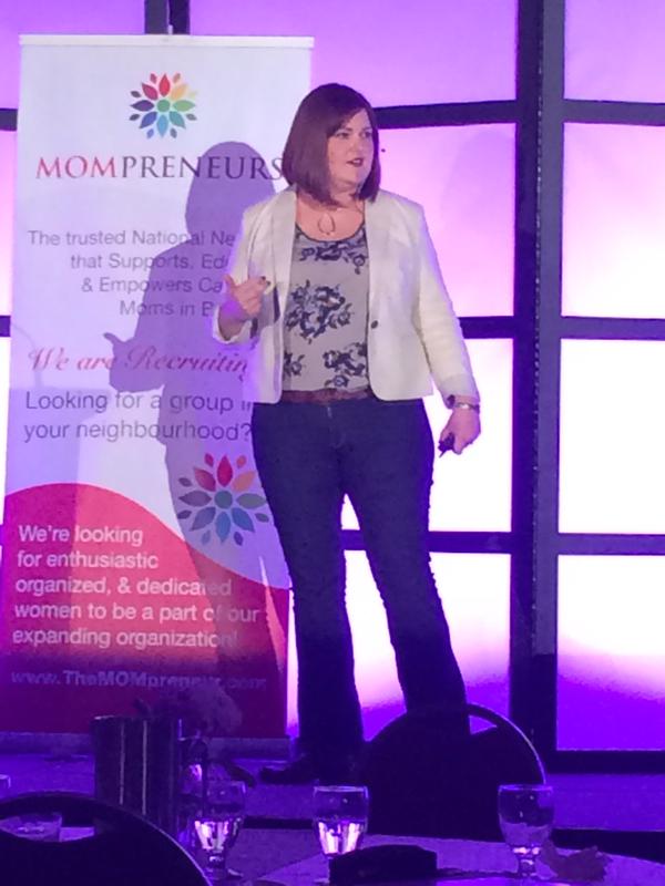 Avery Swartz speaking from the stage at the Mompreneur Conference